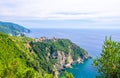 Corniglia traditional typical Italian village with colorful buildings on rock cliff and Manarola