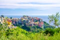 Corniglia traditional typical Italian village with colorful multicolored buildings houses on rock cliff and Genoa Gulf, Ligurian S