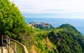 Corniglia traditional typical Italian village with colorful multicolored buildings houses on rock cliff and Genoa Gulf, Ligurian S