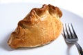 Cornish pasty meat pie and fork Royalty Free Stock Photo