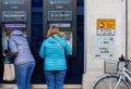 Cornmarket Street, Oxford, United Kingdom, January 22, 2017: Customers using a Barclays Bank ATM Bancomats Free Cash Withdrawals Royalty Free Stock Photo
