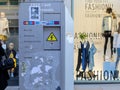 Cornmarket Street, Oxford, United Kingdom, January 22, 2017: Shopping windows with manequins and ATM Bancomat on Royalty Free Stock Photo