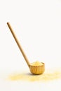 Cornmeal in a wooden ladle and on a white background Royalty Free Stock Photo