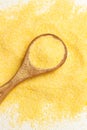 Cornmeal on a wooden spoon and on a white background Royalty Free Stock Photo