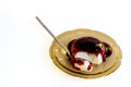 cornstarch dessert with red wine sauce, chilean dessert, eating on white background