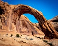 Corona Arch in Utah with the moon in the sky