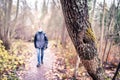 Corona depression, anxiety, loneliness and social distancing concept. Lonely sad man walking in forest alone during coronavirus. Royalty Free Stock Photo