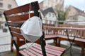 Corona crisis - lockdown - FFP2 mask hangs on a chair in an empty beer garden in Steyr, Austria, Europe