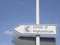 Corona: Signpost to a COVID-19 Vaccination Center in Germany