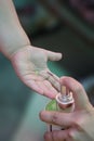 Corona virus or COVID-19 pandemic prevention, Mother put hand sanitizer to her daughter hand. wash hands with Alcohol based hand Royalty Free Stock Photo