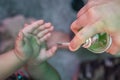 Corona virus or COVID-19 pandemic prevention, Mother put hand sanitizer to her daughter hand. wash hands with Alcohol based hand Royalty Free Stock Photo