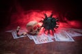 Corona virus miniature and money on wooden table with fog and backlight. Creative artwork decoration. Selective focus Royalty Free Stock Photo