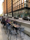 London city with restaurants tables on the sidewalk to help the hospitality industry recover from covid crisis