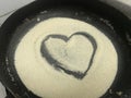 During corona virus pandemic quarantine i was trying to cook semolina and drawn this love symbol to show i love cooking in heart