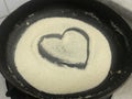 During corona virus pandemic quarantine i was trying to cook semolina and drawn this love symbol to show i love cooking in heart