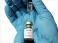 Corona virus protection. Doctor holds in hand syringe and vial with vaccine for coronavirus cure