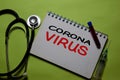 Corona Virus write on a paperwork isolated on Office Desk. Mysterious Viral Pneumonia in Wuhan, China. Healthcare/Medical concept