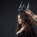 Coronation of Gothic Queen. Image on Halloween. Young beautiful woman in black Royalty Free Stock Photo