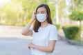 Coronavirus and Air pollution pm2.5 concept.Asian woman wearing medical face mask. Woman Wearing Protective Mask. Woman wearing