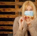 Coronavirus, air pollution pm2.5, quarantine and risk of public places. Beautiful woman can not eat pizza at restaurant because Royalty Free Stock Photo