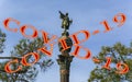 Coronavirus in Barcelona, Spain. Covid-19 sign. Concept of COVID pandemic and travel in Europe. Chistopher Columbus monument