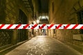 Coronavirus in Barcelona, Spain. Covid-19 sign. Concept of COVID pandemic and travel in Europe. Gothic quarter at night. Royalty Free Stock Photo