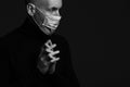 Coronavirus, Bio Protection Concept. Close up profile portrait of handsome bald man wearing medical mask, black turtleneck and