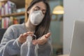 Coronavirus. Business woman working from home wearing protective mask. Business woman in quarantine for coronavirus wearing protec