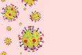 Coronavirus cells in on a pink background with copy space. Yellow red microscopic 3D molecule model of flu virus. Concept of COVID