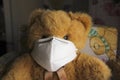 Coronavirus child: teddy bear with mask