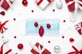 Coronavirus Christmas concept. Face mask in frame made of Christmas gift boxes and decorations on white background Royalty Free Stock Photo