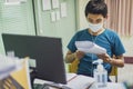 Coronavirus or covid-19. Asian men wearing mask protection, work from home with disinfectant gel Royalty Free Stock Photo