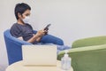 Coronavirus or covid-19. Asian men wearing mask protection, Work from home with disinfectant gel or alcohol gel Royalty Free Stock Photo