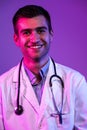 Coronavirus covid-19 danger alert Portrait of hero in white coat. Cheerful smiling young doctor with stethoscope in