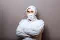 Coronavirus covid-19 disinfection. Portrait caucasian doctor in protective medical suit, biological hazard, medical mask FFP3,