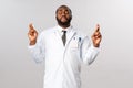 Coronavirus, covid19 and healthcare concept. Hopeful african-american male doctor feel uneasy during hard days of