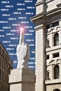 Coronavirus Covid-19 in Milan.. Sculpture of Cattelan`s finger in front of the Milan Stock Excha