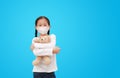 Coronavirus covid-19 and pollution protection concept. Asian little kid girl hugging teddy bear doll with wearing mask to against Royalty Free Stock Photo