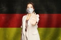 Coronavirus COVID-19 prevention and SARS cov 2 and Coronavirus disease in Germany concept. Woman in anti virus protection mask