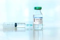 Coronavirus COVID-19 Vaccine Vials and Syringe On Reflective Surface Royalty Free Stock Photo