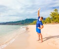 Coronavirus COVID 19. Young beautiful man doing sport performing workouts exercises and turns near sea in the morning