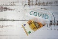Coronavirus crisis in europe wallpaper new ncov 2019 virus medical mask with the inscription covid with fifty euro banknote