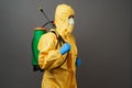 Coronavirus disinfection concept. Man in hazmat suit making disinfection