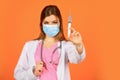 Coronavirus epidemic from china. selective focus. woman doctor use syringe. nurse make injection in respirator mask Royalty Free Stock Photo