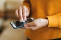 Coronavirus global epidemic. Woman disinfecting phone with antiseptic wet wipe