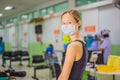 Coronavirus in the hospital covid 19. Woman in a medical mask Patients In Doctors Waiting Room Royalty Free Stock Photo