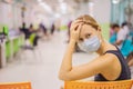 Coronavirus in the hospital covid 19. Woman in a medical mask Patients In Doctors Waiting Room Royalty Free Stock Photo