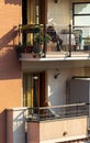 TURIN, ITALY- 03-14-2020: Coronavirus Italy Turin Women look the city on balcony