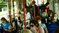 PRAGUE, CZECH REPUBLIC, JUNE 22, 2020: Coronavirus mask face sneezing coughing hand people tram crowd passengers, public