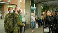 OLOMOUC, CZECH REPUBLIC, JUNE 22, 2020: Coronavirus mask face people crowd tram streetcar stop tram army soldier